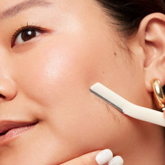 Revlon Face Defuzzer on peach fuzz for smoother makeup.