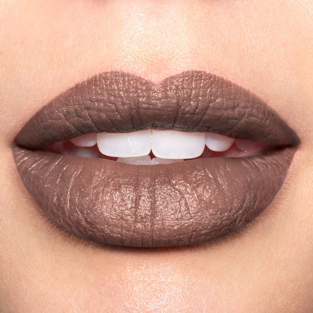 REVLON Luscious Mattes bullet application demonstrates smooth glide and velvety finish.