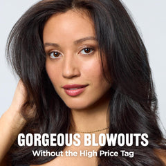 REVLON One-Step Volumizer close-up on nylon-natural bristles smoothing hair.