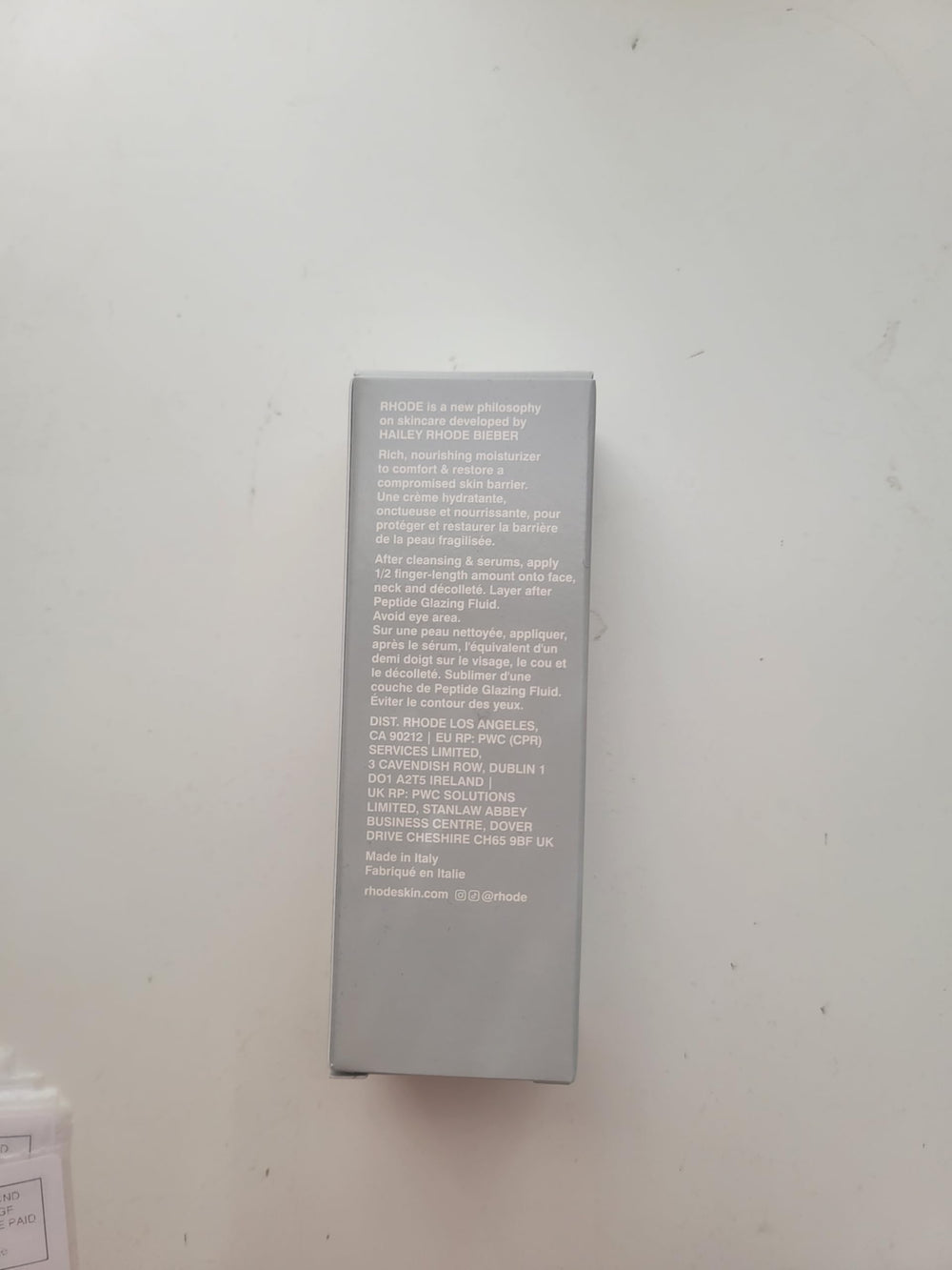 Rhode Barrier Restore Cream application on skin demonstrates gentle massage.