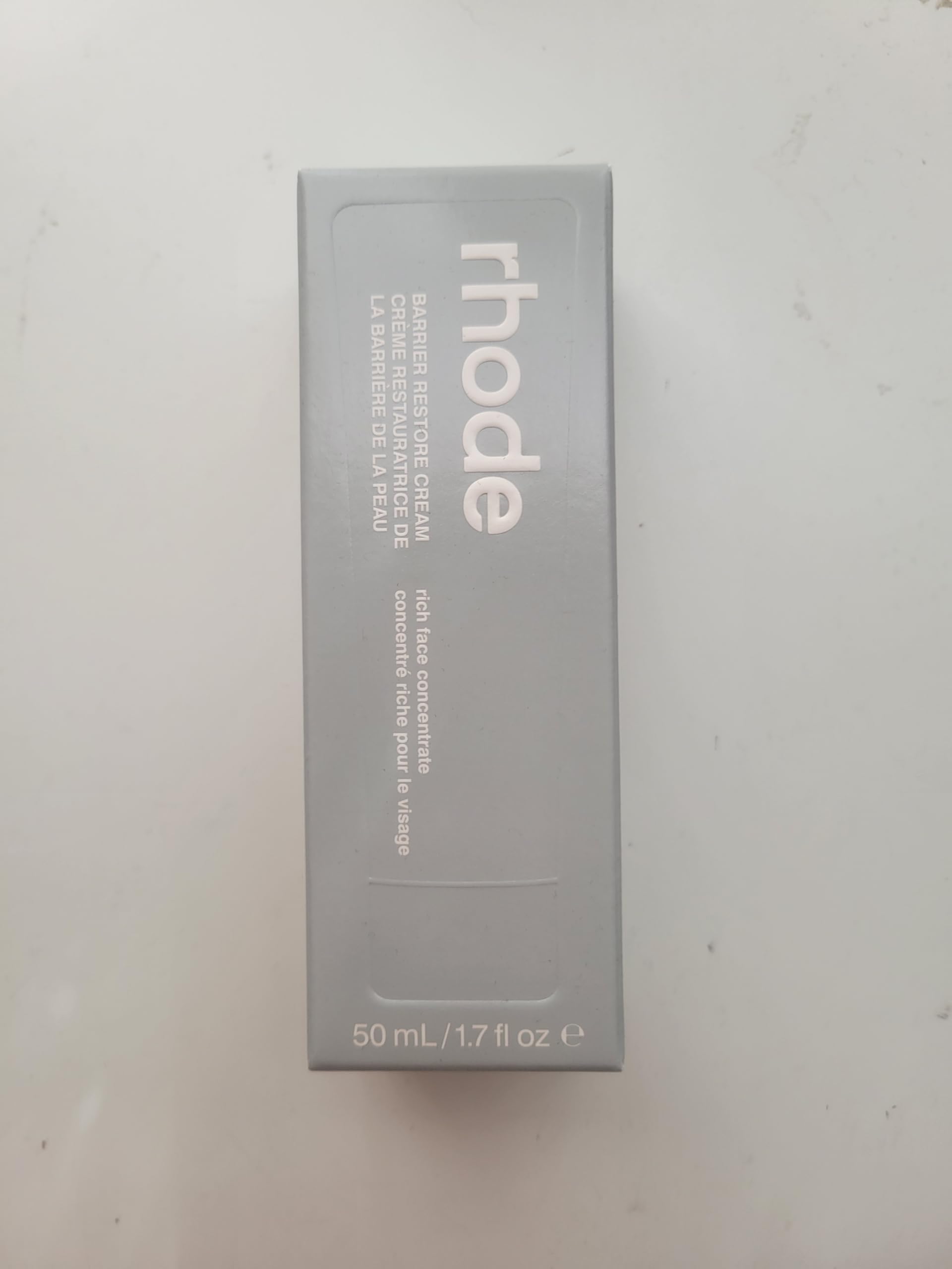 Rhode Barrier Restore Cream texture close-up emphasizes lightweight absorption.