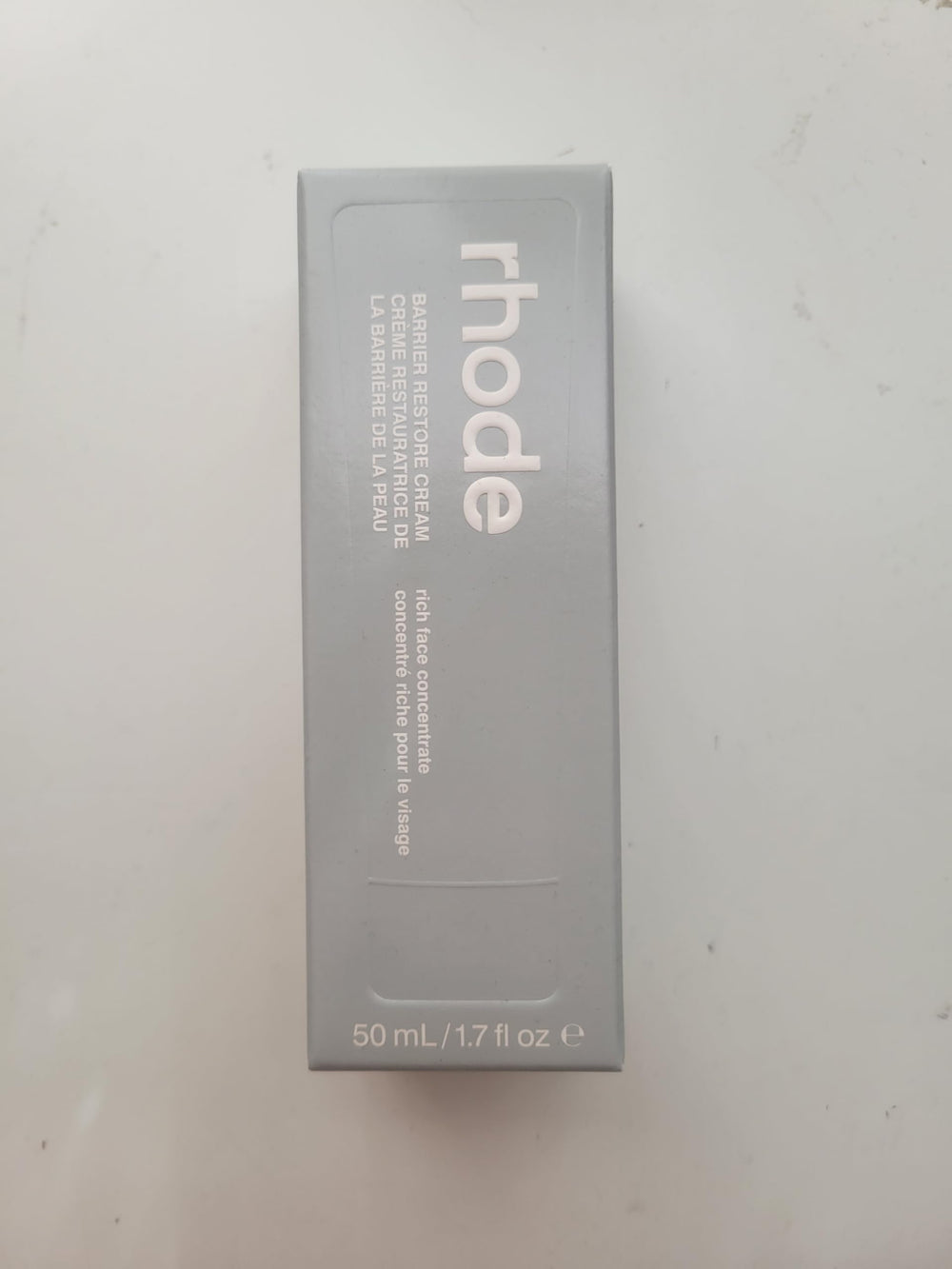 Rhode Barrier Restore Cream texture close-up emphasizes lightweight absorption.