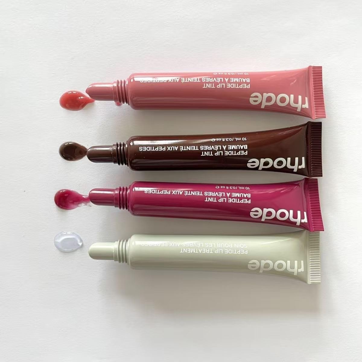 Rhode Gloss Lip Tint Toast packaging emphasizes travel-friendly 8 ml tube