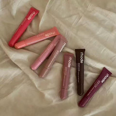 Rhode Gloss Lip Tint Toast swirl demonstrates glossy finish and smooth texture