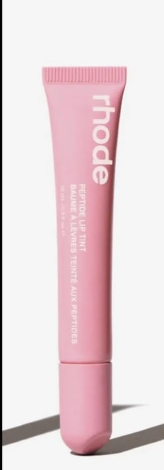 Rhode Lip Tint Ribbon Pink offers sheer color with hydrating, plumping lip care.