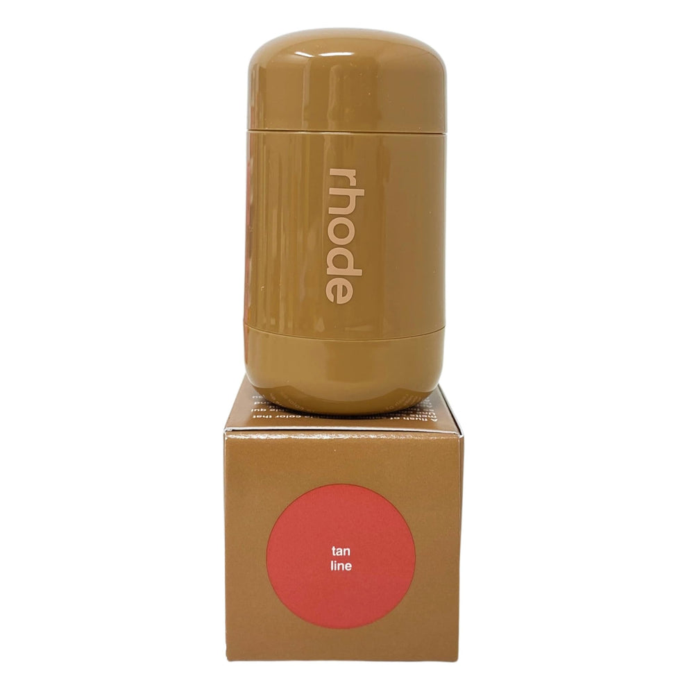 Rhode Pocket Blush Tan Line swatch on cheek reveals pinky tan glow.