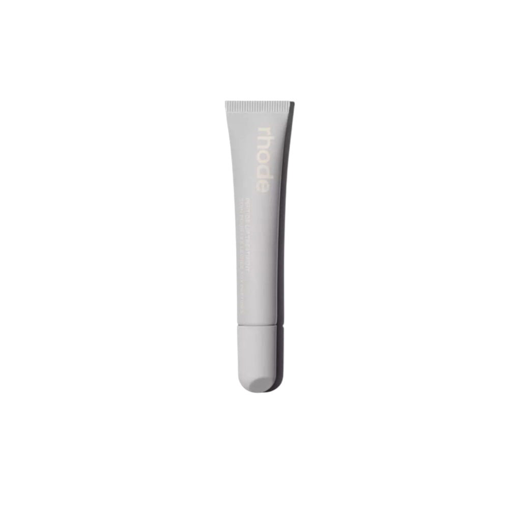 Rhode Salted Carmel lip treatment bottle showing compact, glossy finish for on-the-go use.