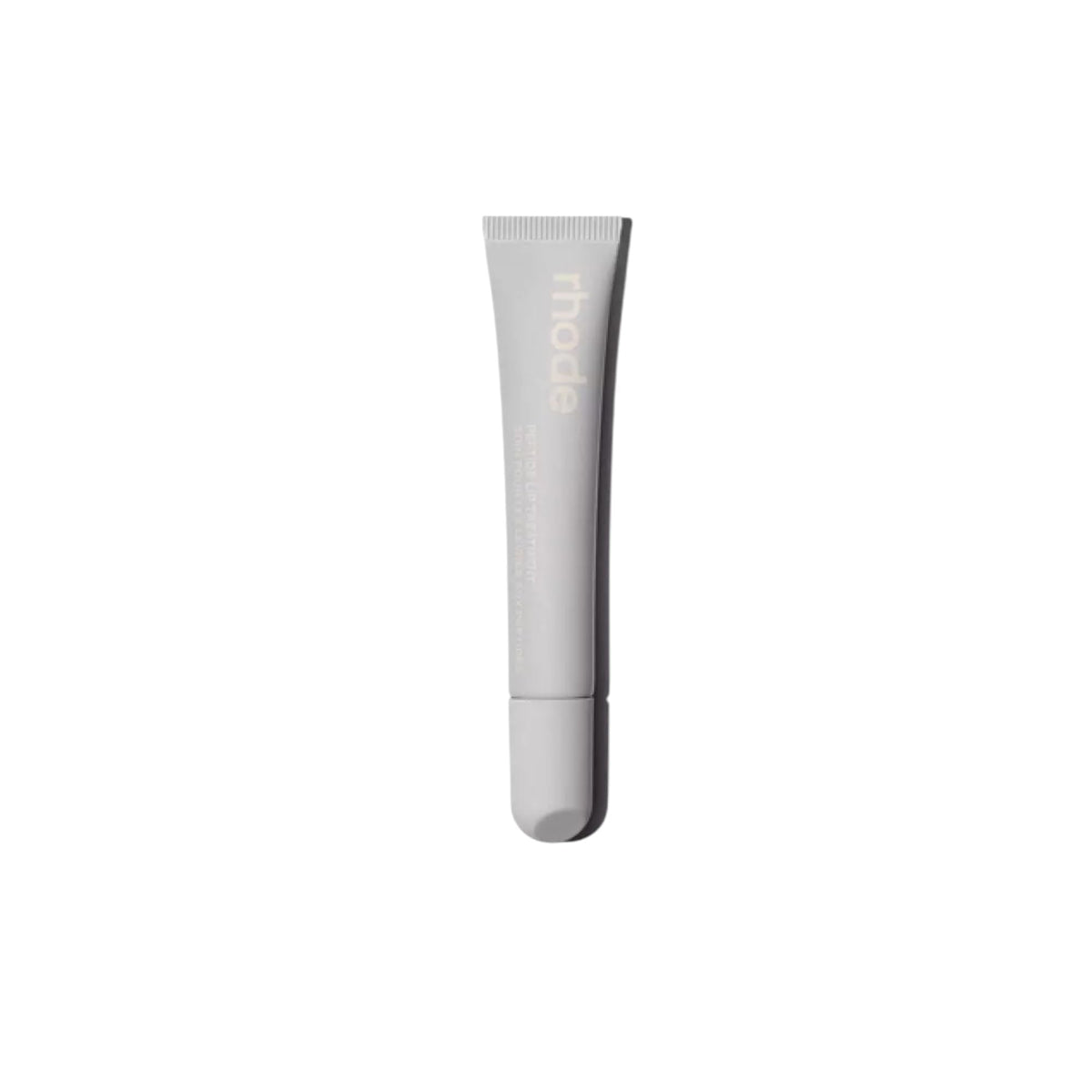 Rhode Salted Carmel lip treatment bottle showing compact, glossy finish for on-the-go use.