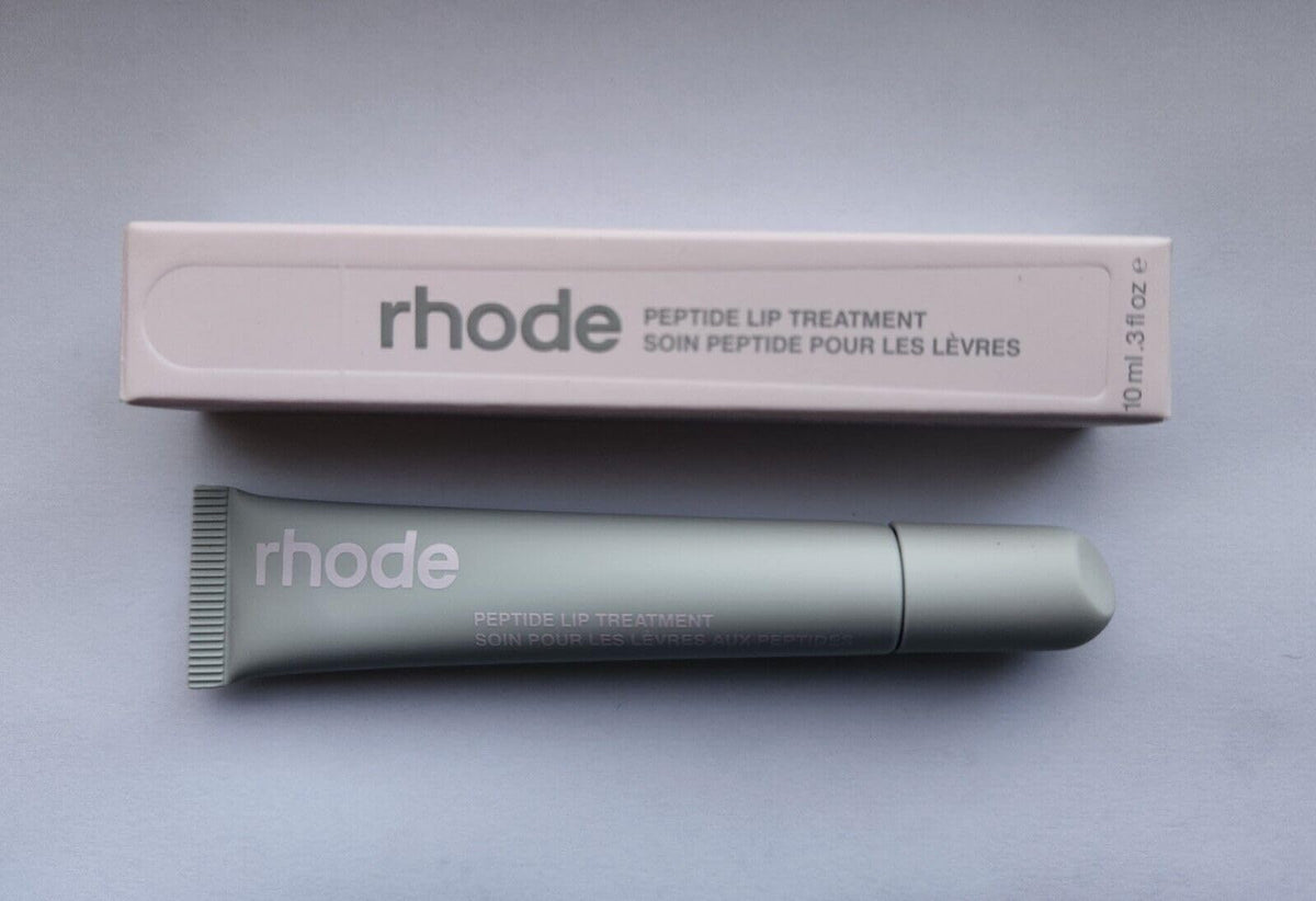 Rhode Watermelon Slice Lip Treatment bottle delivering hydration with a glossy finish.