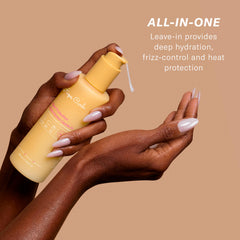 Rizos Curls Multivitamin Leave-In applying as styling prep before heat styling.