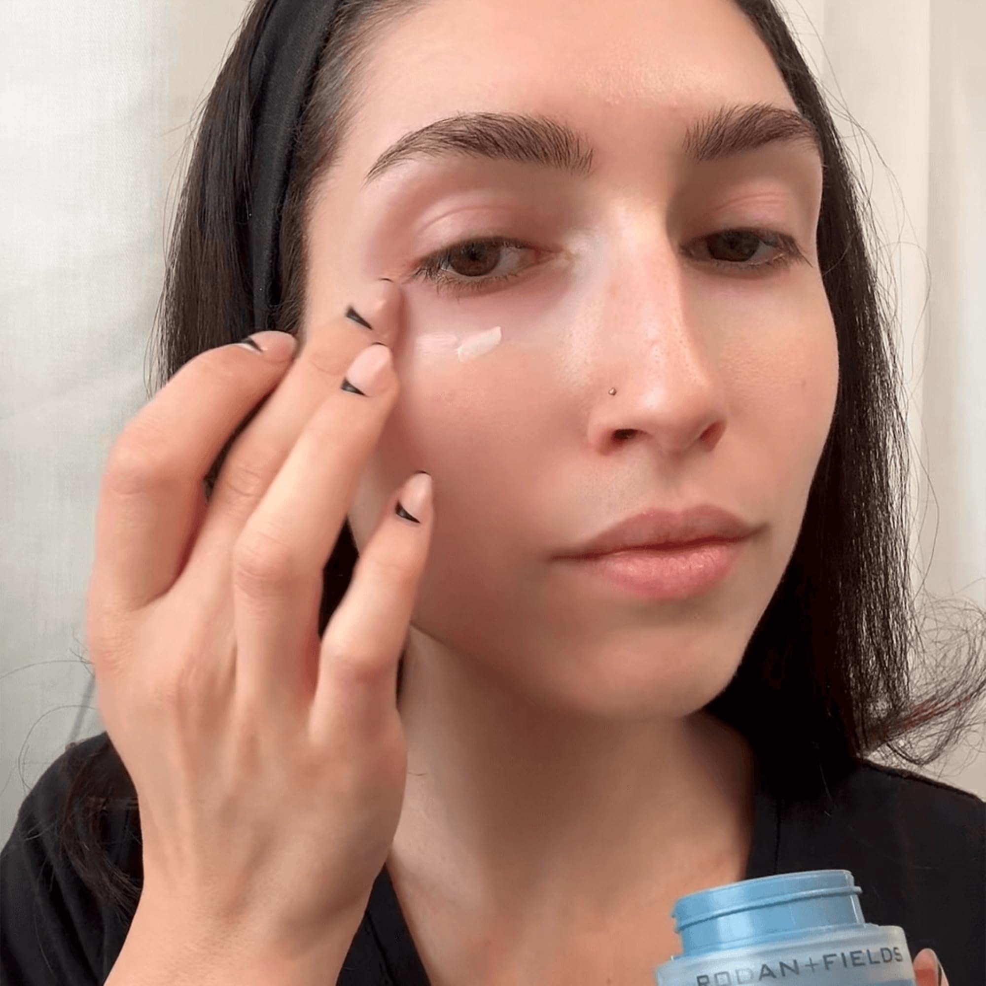 RODAN + FIELDS ReDefine Eye Cream application demonstrates gentle patting around the orbital bone.