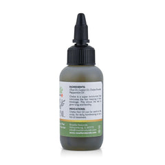 Roselle Naturals Chebe Oil cap closeup signaling premium care and scalp benefits