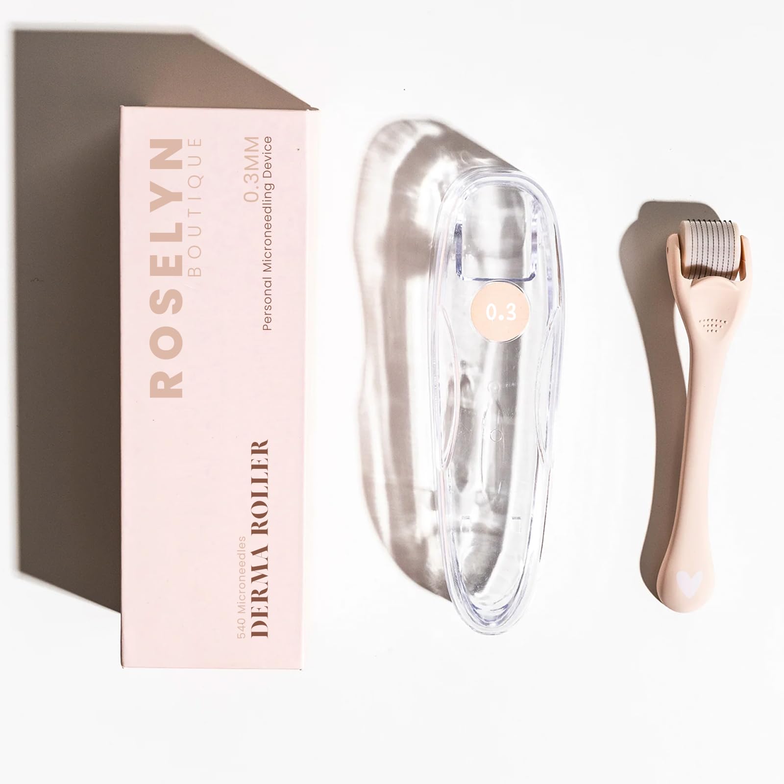 ROSELYNBOUTIQUE derma roller in use on a cheek or beard area.