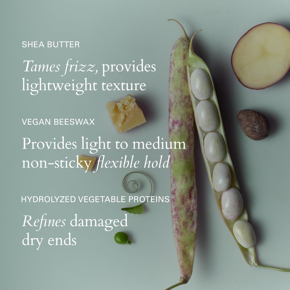 Hands applying RŌZ Evergreen Styling Cream for even distribution and softness.