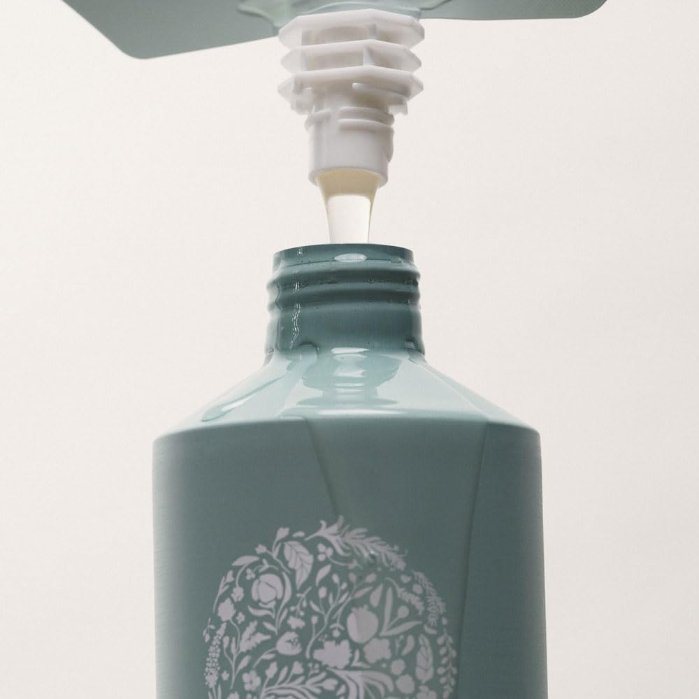 Close-up of luxurious coconut-based lather from RŌZ Foundation Shampoo.