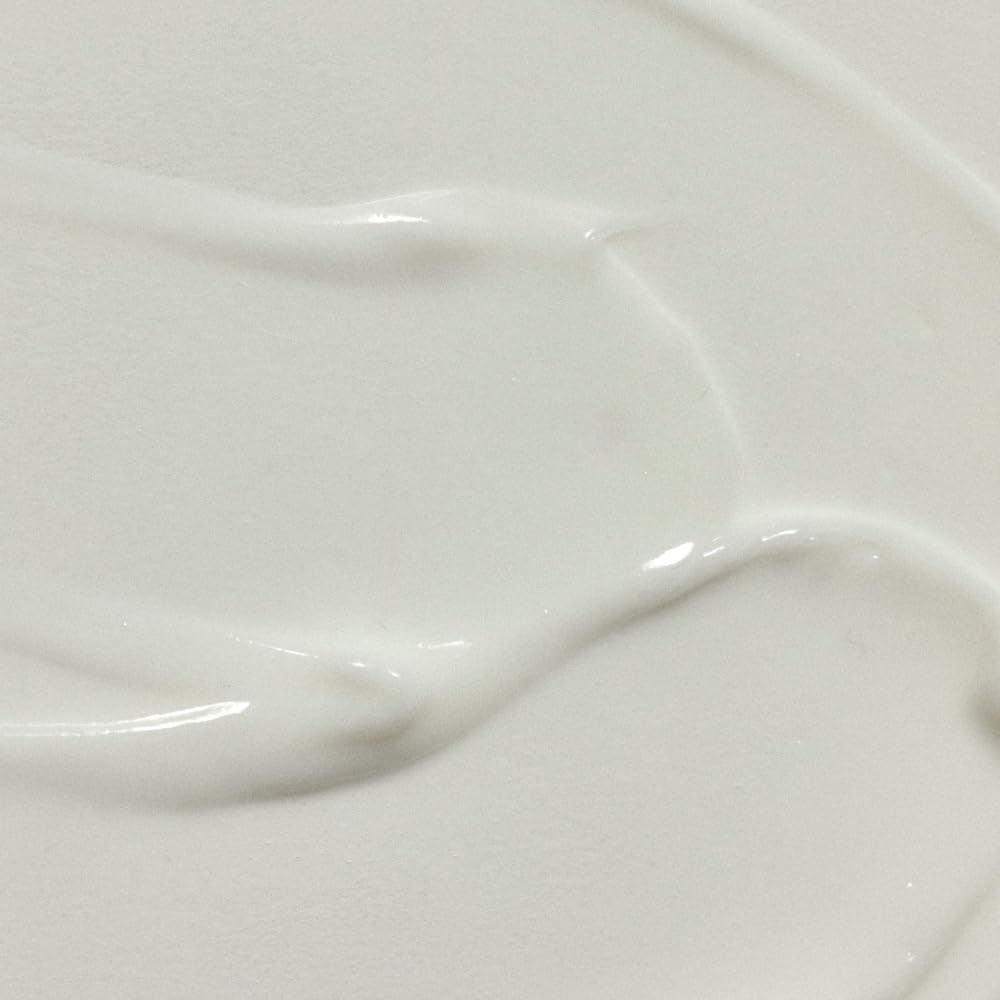 RŌZ Milk Hair Serum texture close-up shows creamy glide