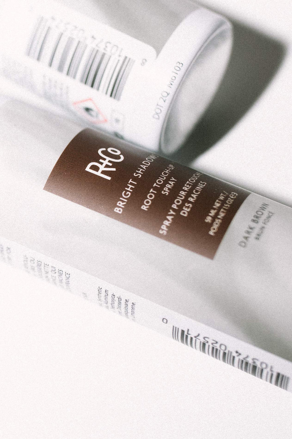Dark brown shade swatch showing natural blend and shine