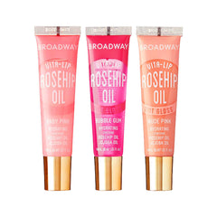 Ruby Kisses Broadway Vita-Lip en rosa bebé, brillo duradero para labios hidratados.