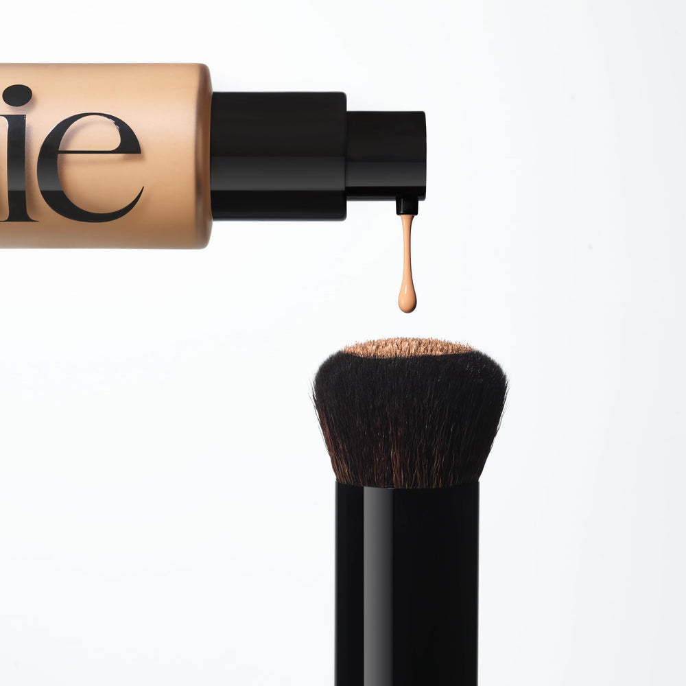 Saie Base Brush used with skin tint for smooth blending and finish.