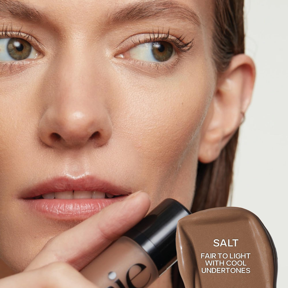 Saie Dew Bronze creates a sun-kissed glow with buildable coverage.