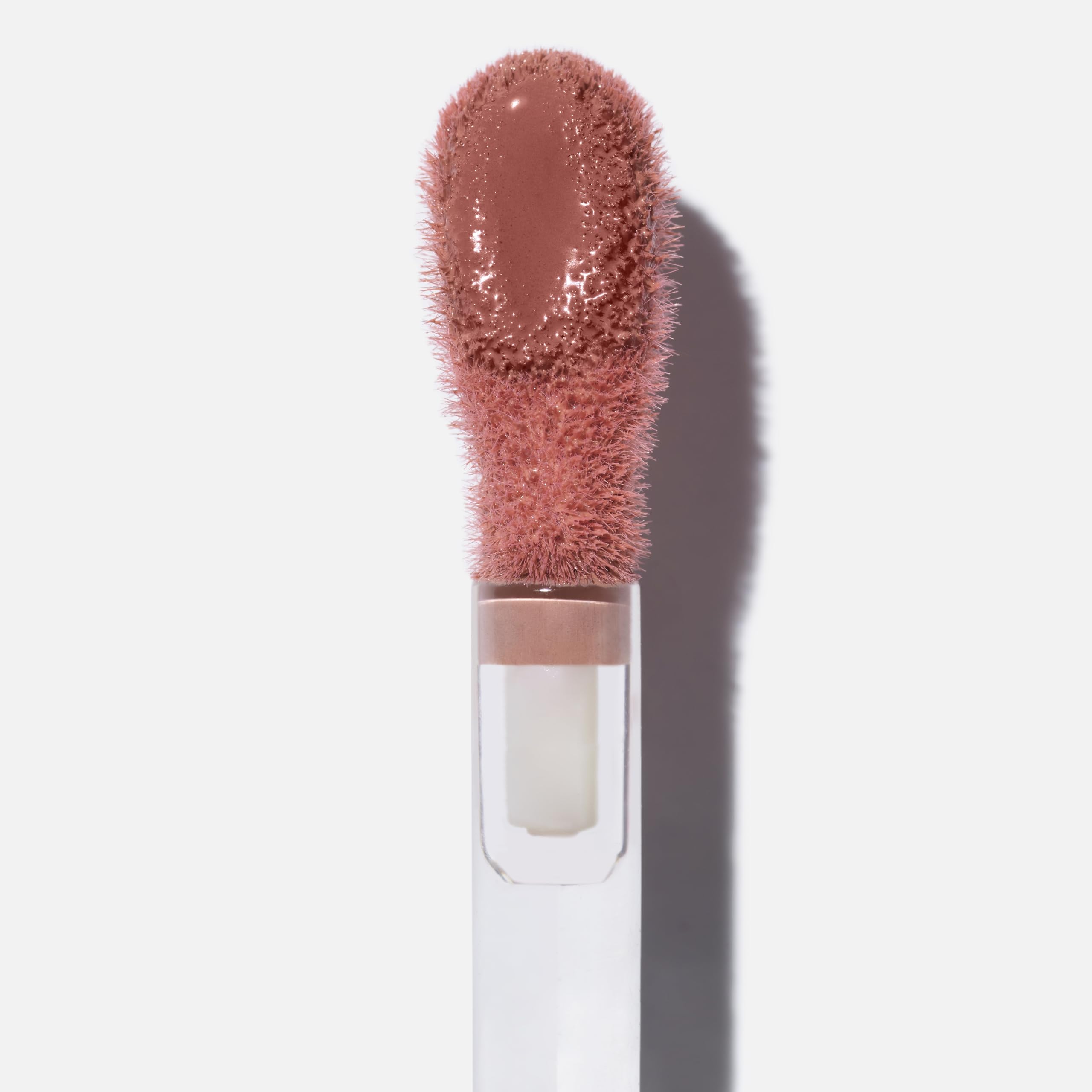 Swatch of Saie Dew on cheek for natural dewy glow.