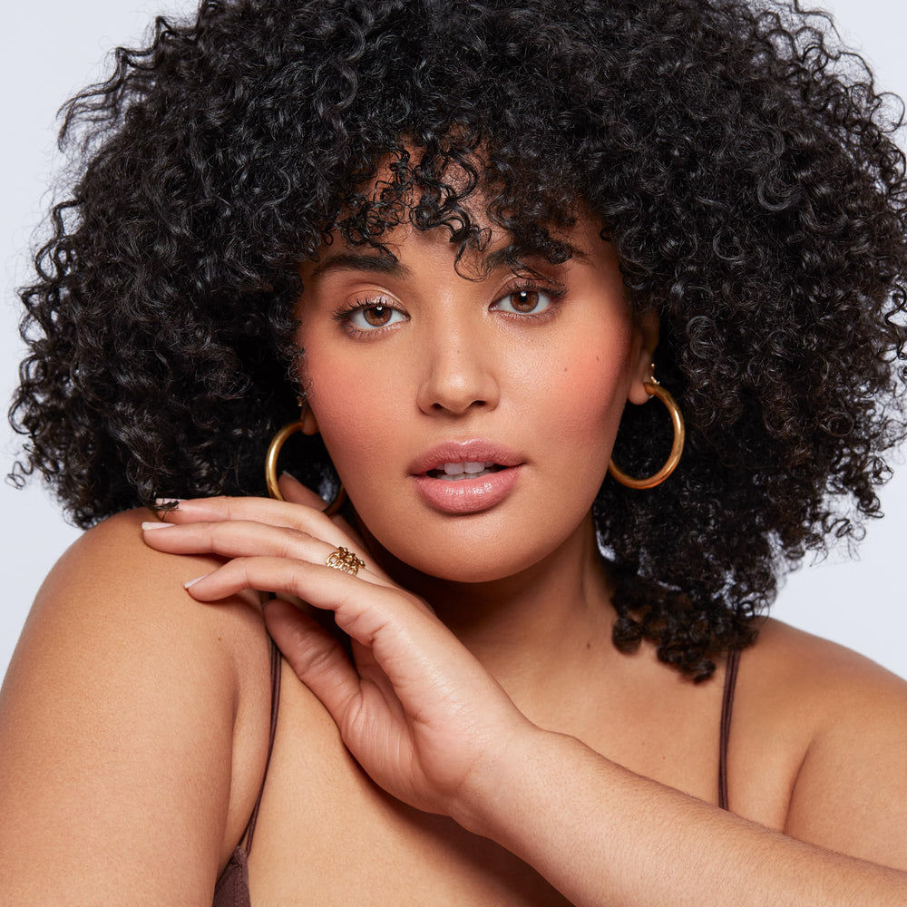 Saie Dew Liquid Blush Poppy finish looks radiant and hydrated.