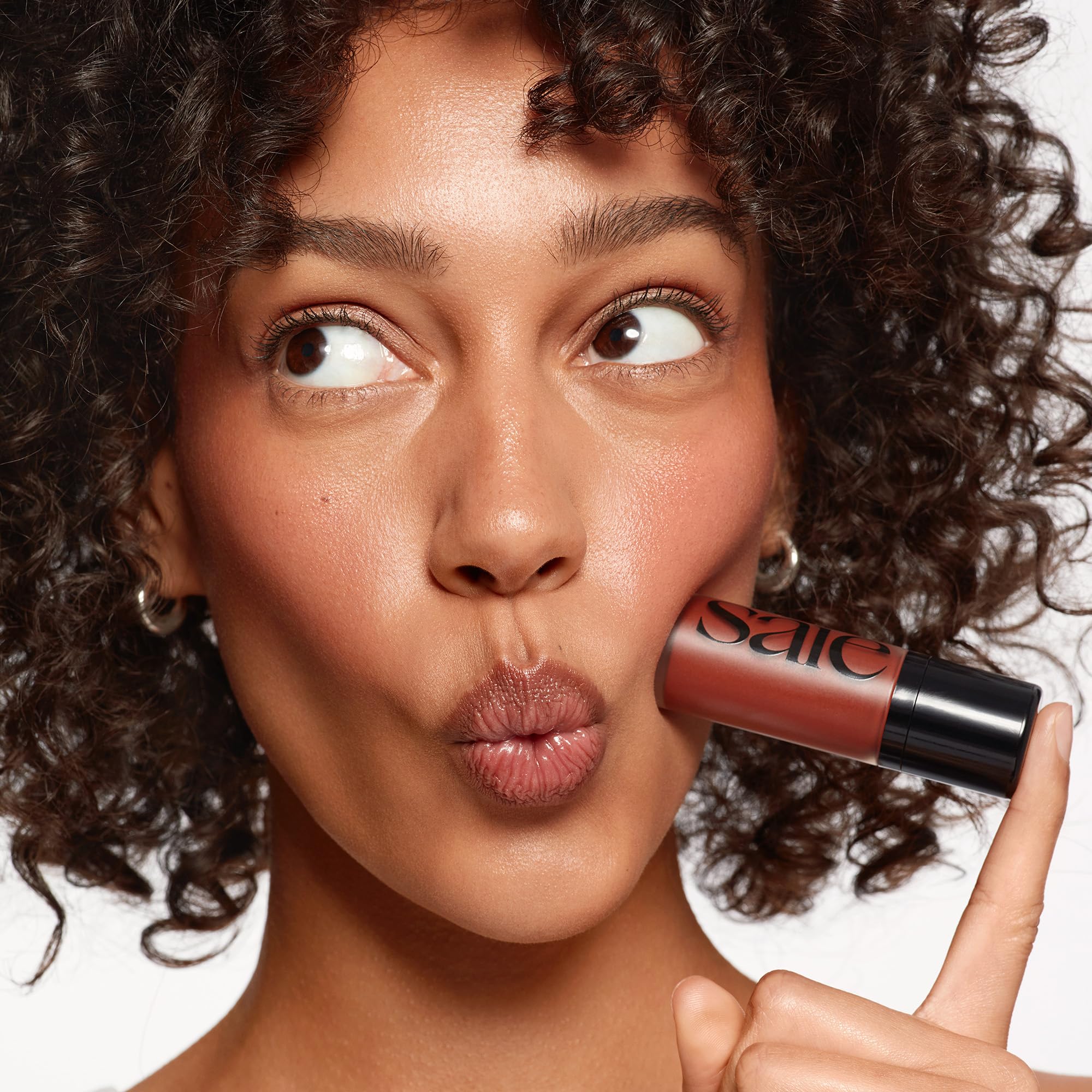 Saie Dew Liquid Blush Spicy on-cheek swatch reveals radiant glow