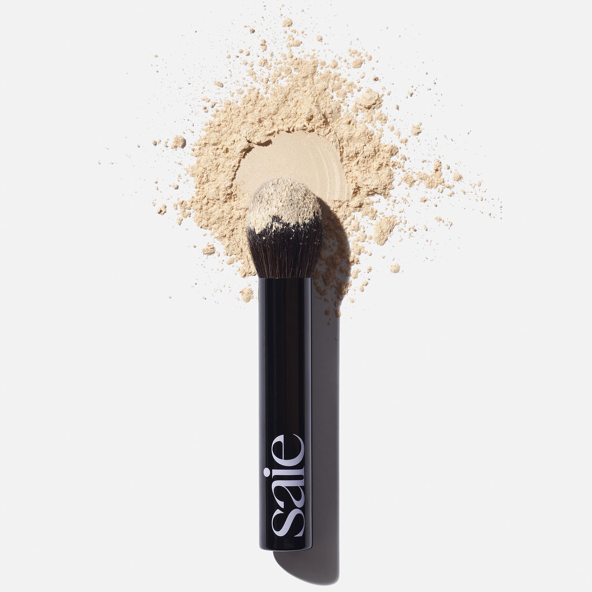 Saie The Fluffy Brush demonstrates multi-use powder application