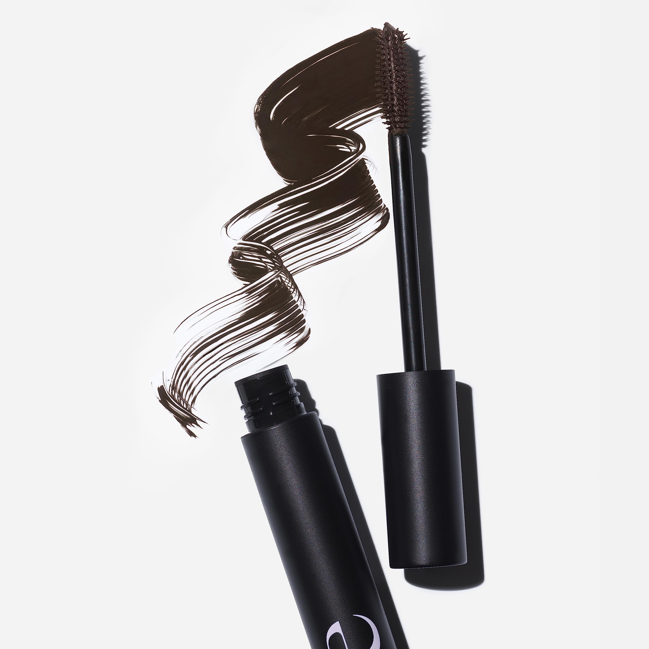 Saie Mascara 101 buildable layers show thicker, bold lashes.