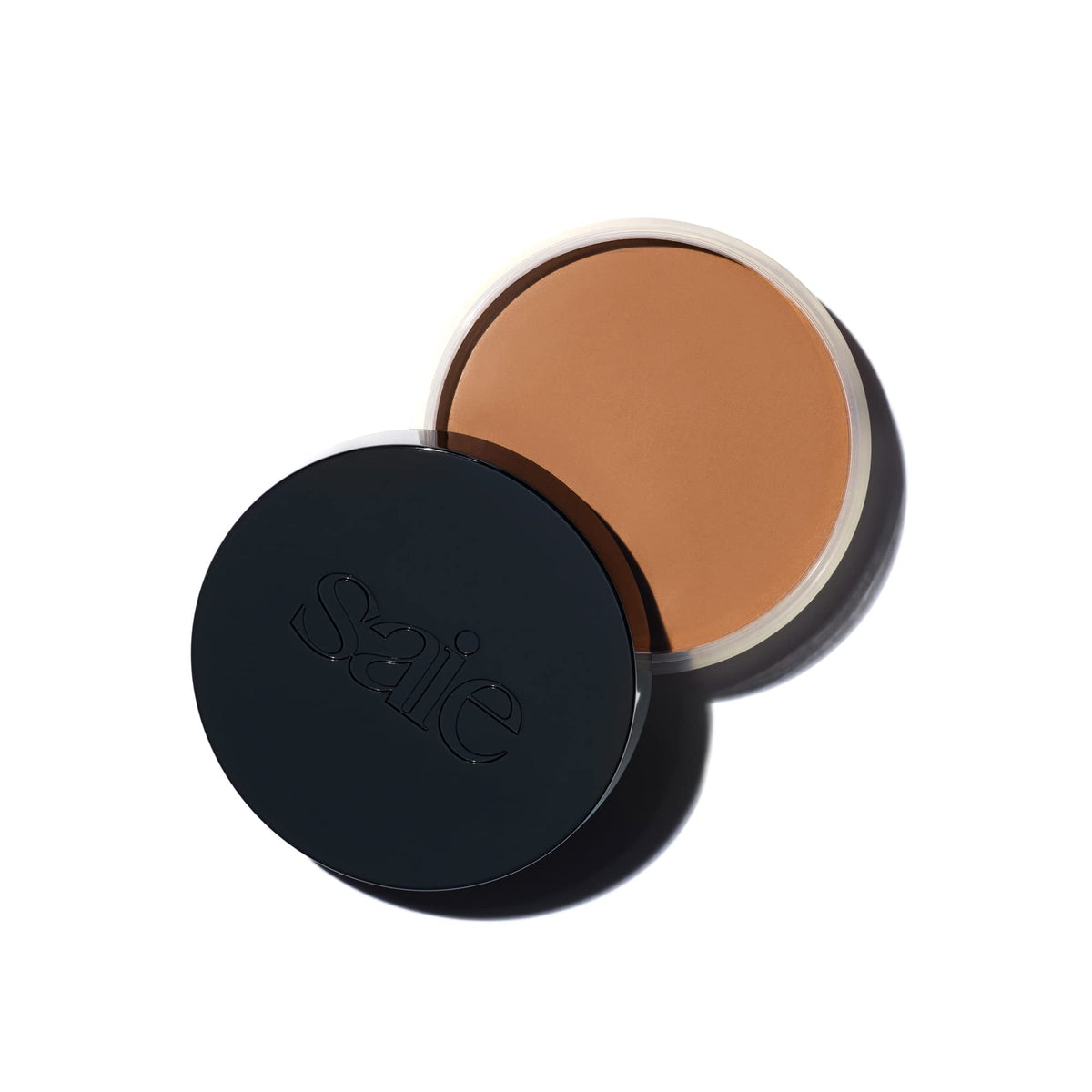 Saie Sun Melt Cream Bronzer packaging close-up showing compact for easy on-the-go color