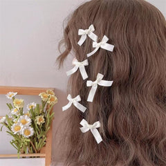 SALOCY black satin clip highlights elegant accents for formal looks.