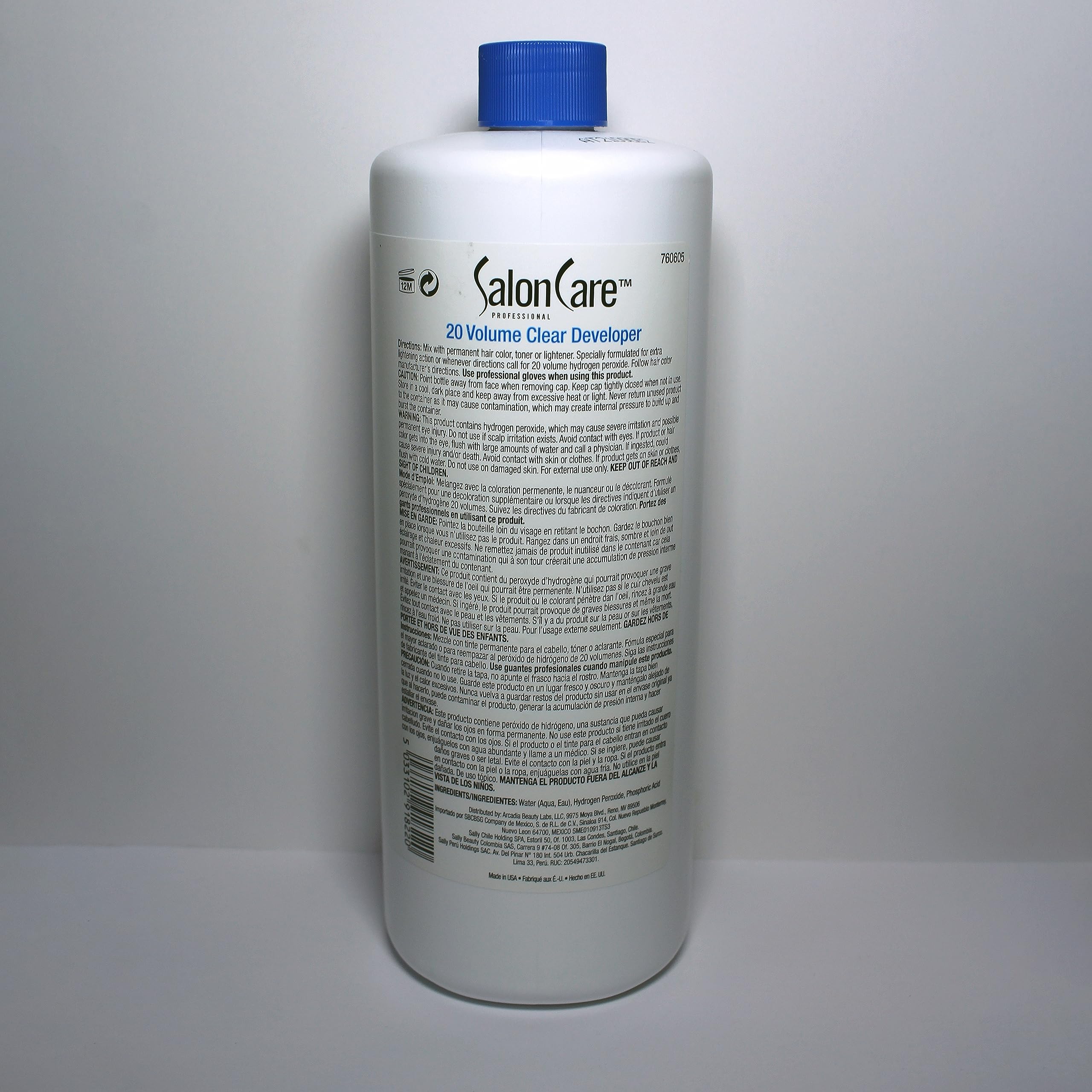 Cap and bottle of Salon Care 20 Volume Clear Developer in studio light.