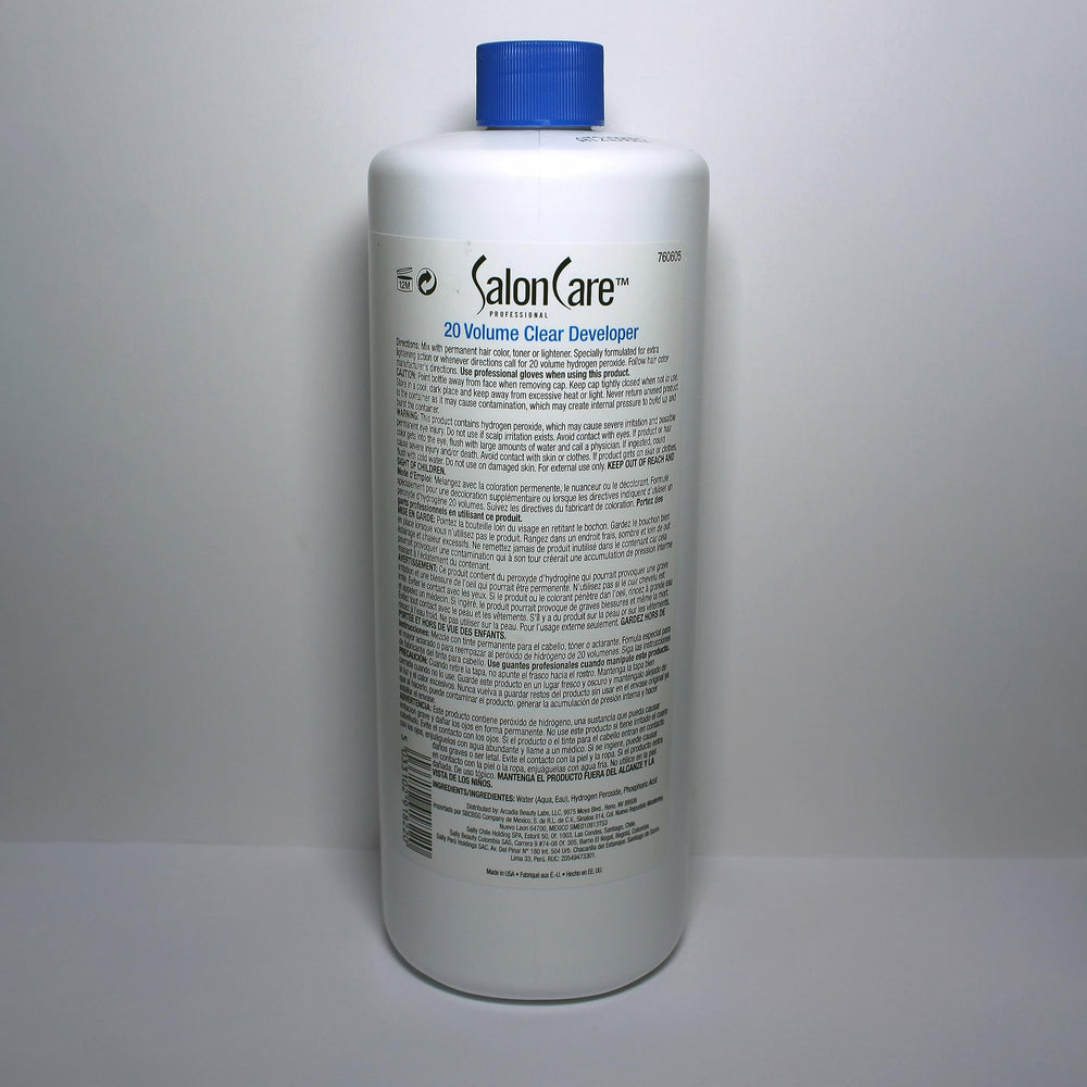 Cap and bottle of Salon Care 20 Volume Clear Developer in studio light.