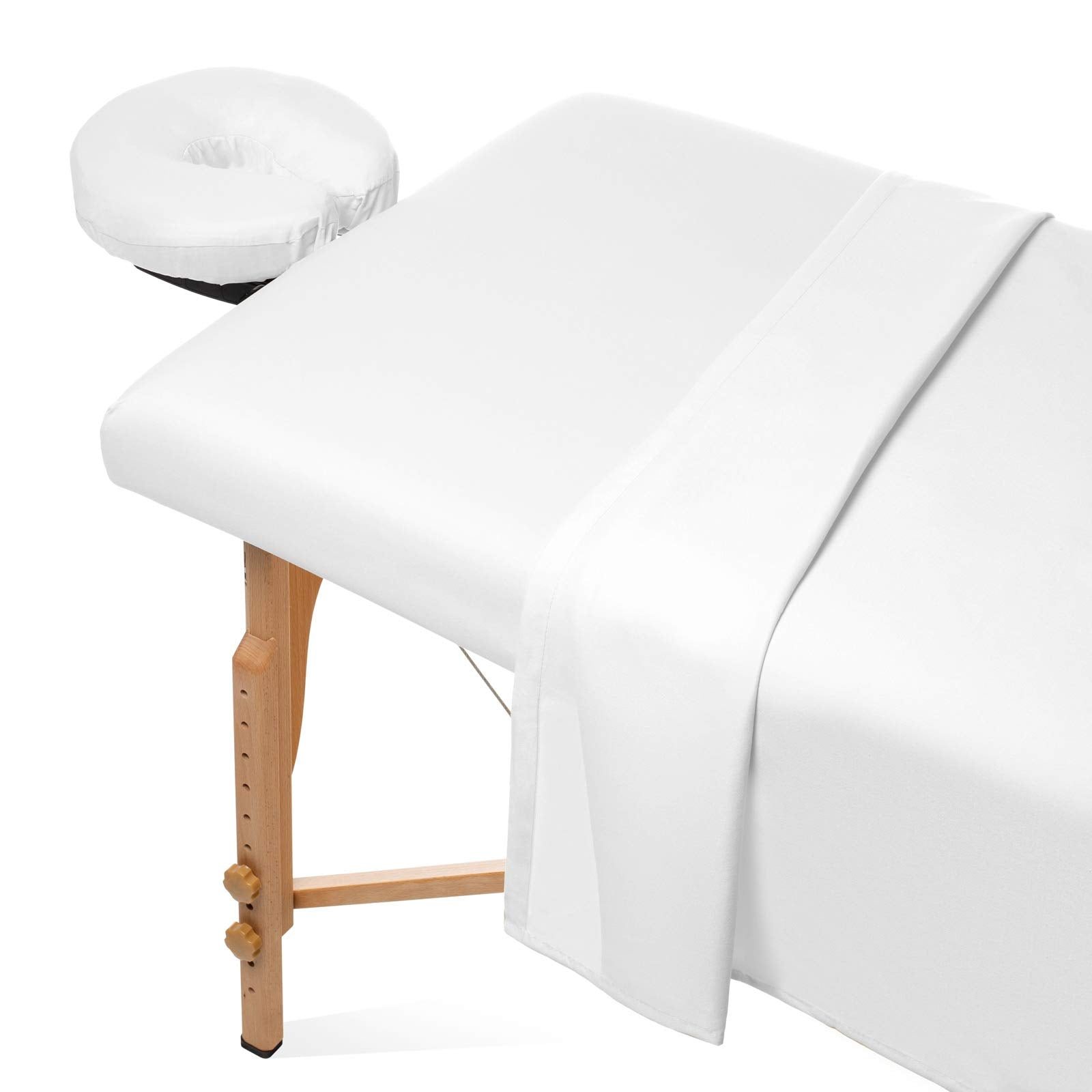 Saloniture flat sheet on a massage table offering breathable comfort for clients.