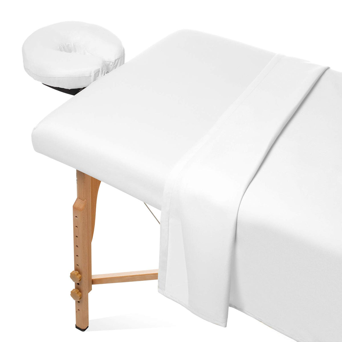 Saloniture flat sheet on a massage table offering breathable comfort for clients.