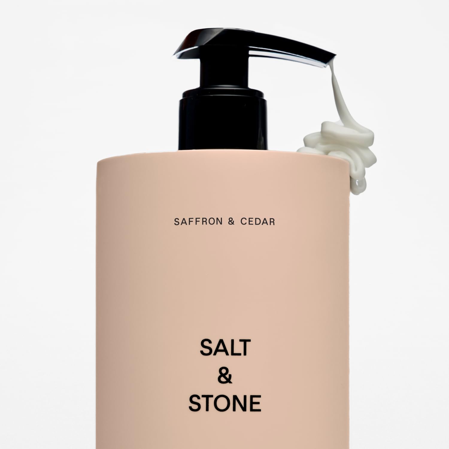Salt & Stone saffron-cedar packaging and bottle on clean vanity for gifting.