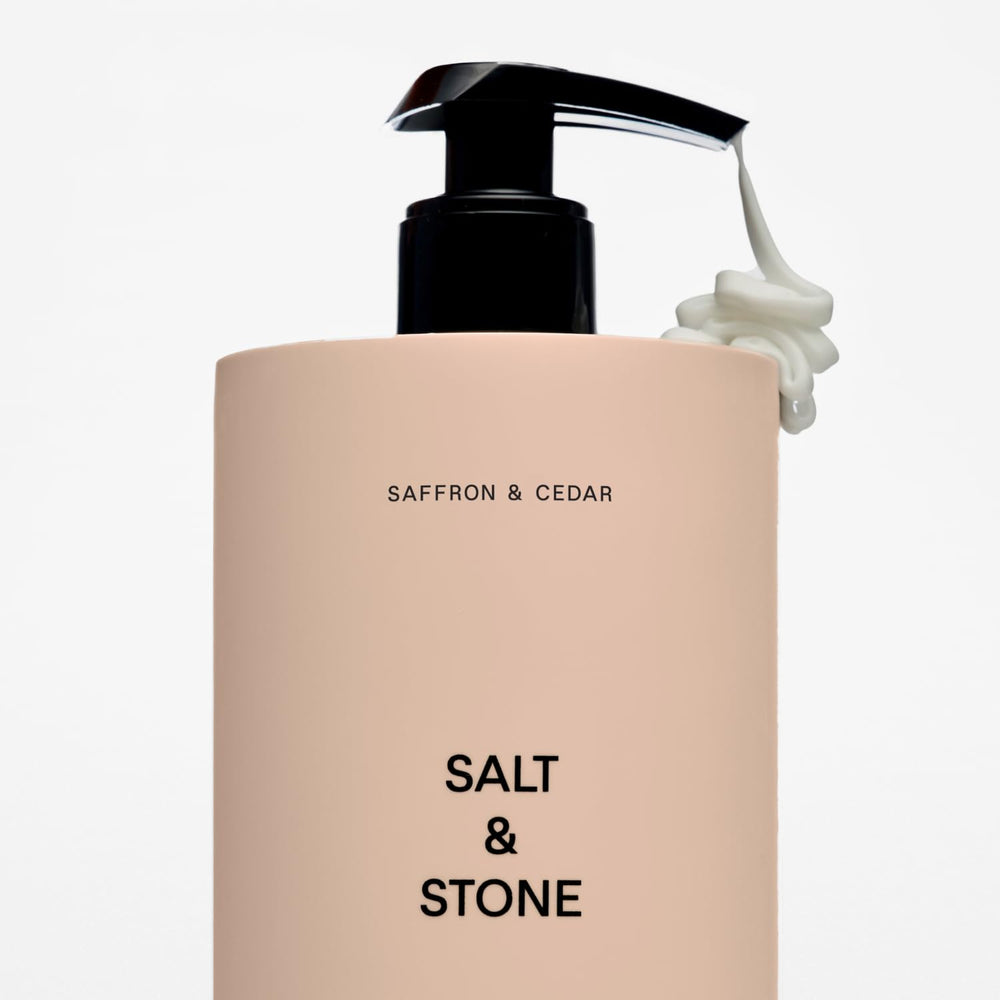 Salt & Stone saffron-cedar packaging and bottle on clean vanity for gifting.
