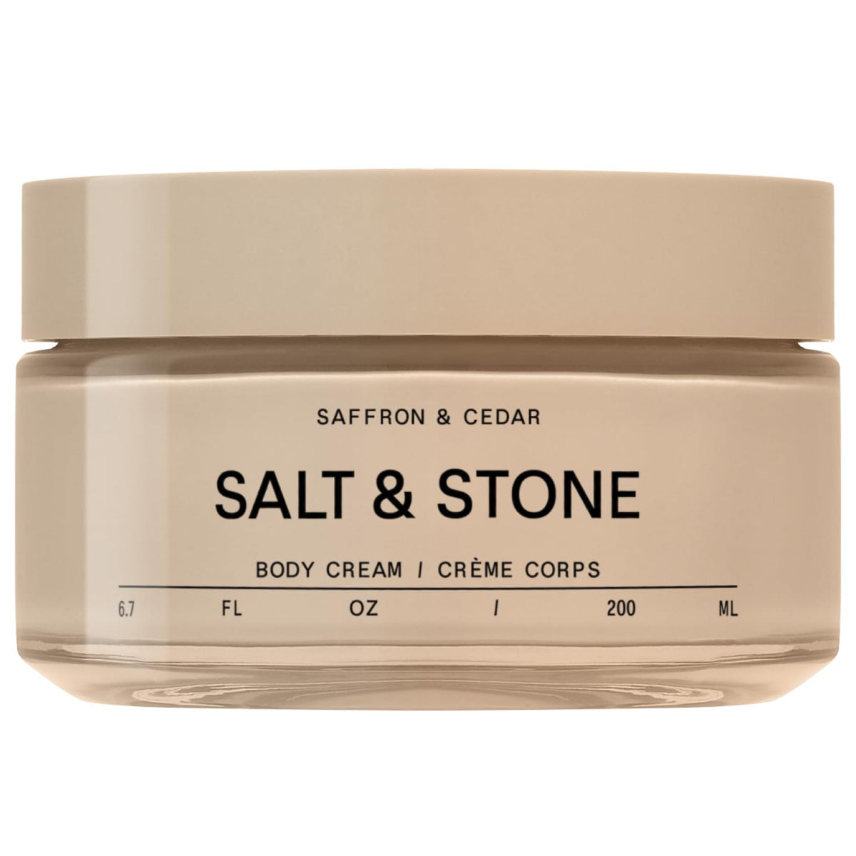 Salt & Stone Body Cream bottle front with warm saffron cedar scent promise.