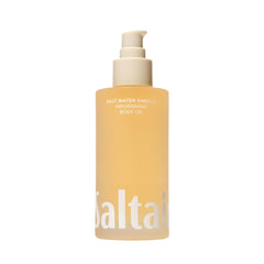 Saltair Body Oil bottle pour showing luxurious salt water vanilla fragrance and quick absorption.