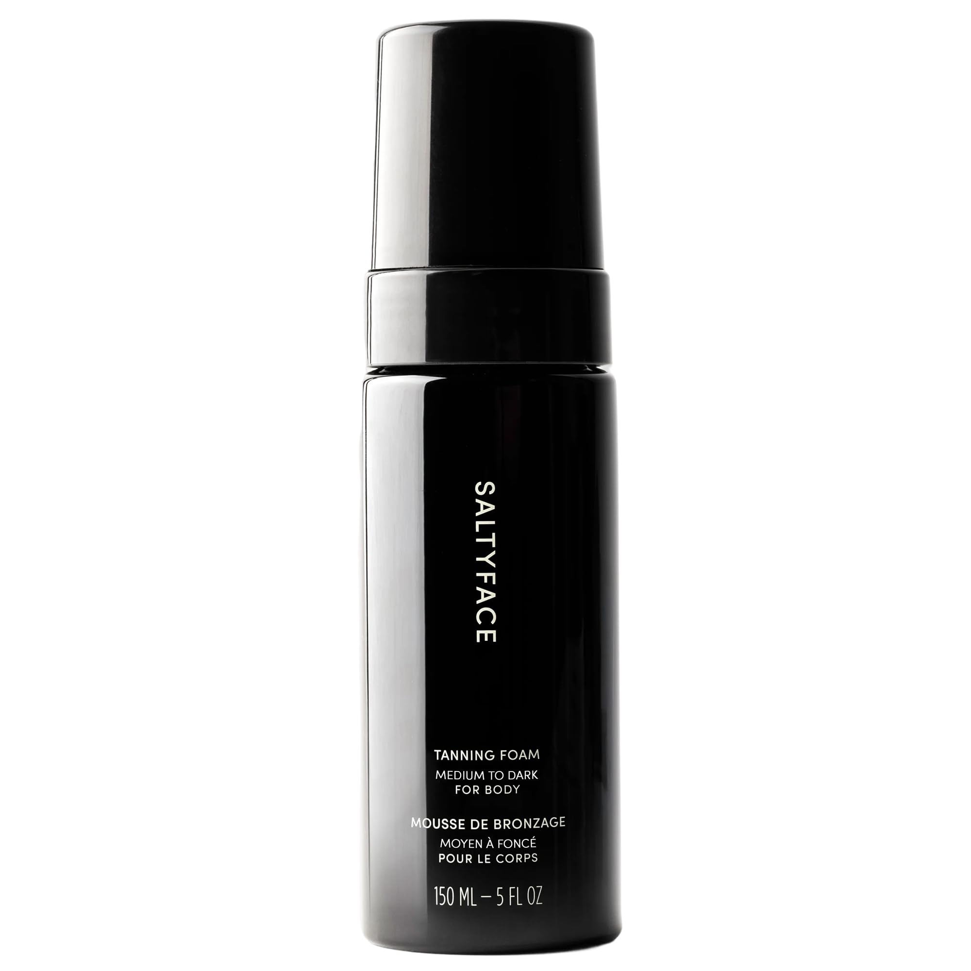 SALTYFACE tanning foam bottle demonstrates oil-free, fragrance-free formula for smooth application.