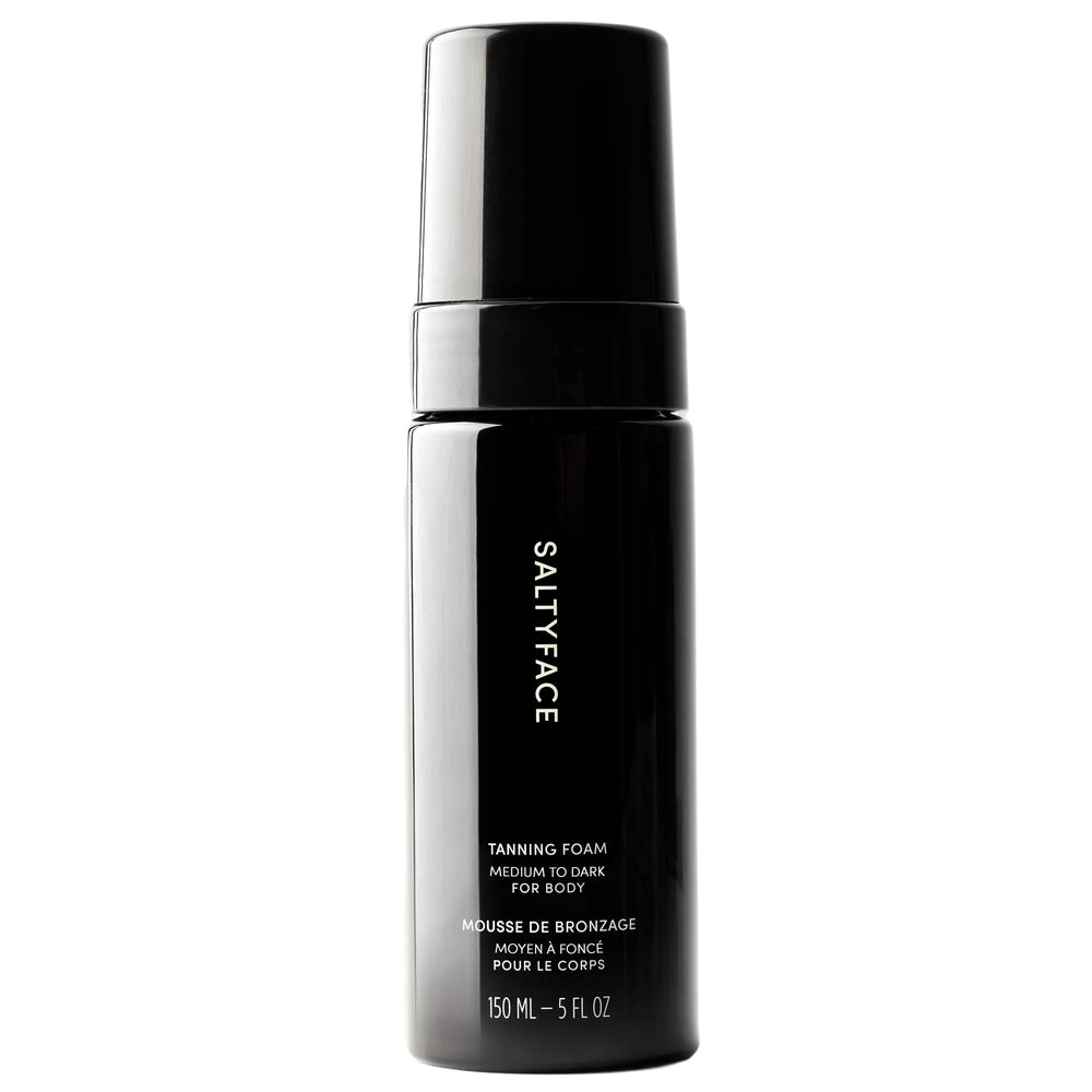 SALTYFACE tanning foam bottle demonstrates oil-free, fragrance-free formula for smooth application.