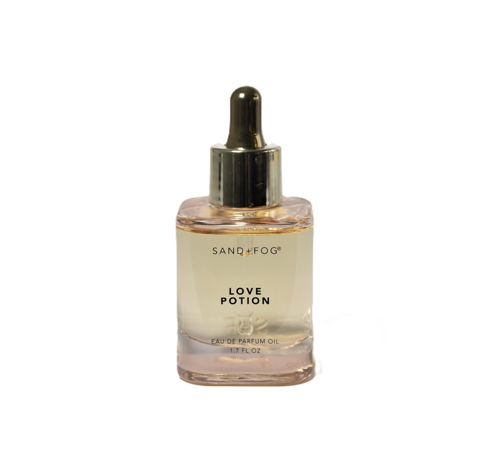 Sand and Fog Love Potion bottle showcases premium parfum oil for long-lasting wear.