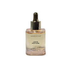 Sand and Fog Love Potion bottle showcases premium parfum oil for long-lasting wear.