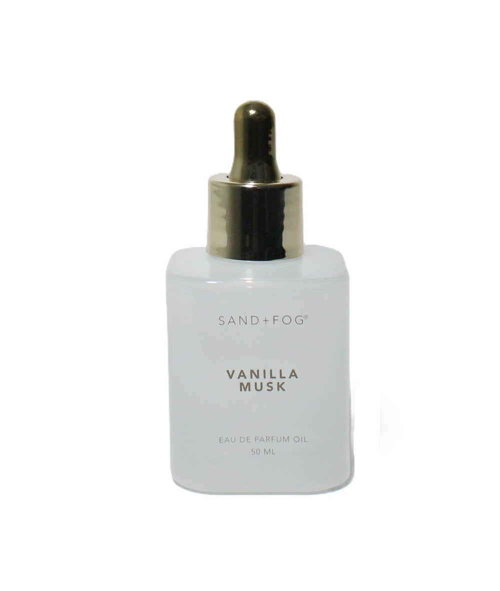 Sand + Fog Vanilla Musk dropper bottle close-up, travel-friendly oil for on-the-go scent.