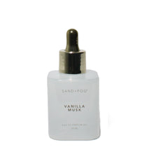 Sand + Fog Vanilla Musk dropper bottle close-up, travel-friendly oil for on-the-go scent.