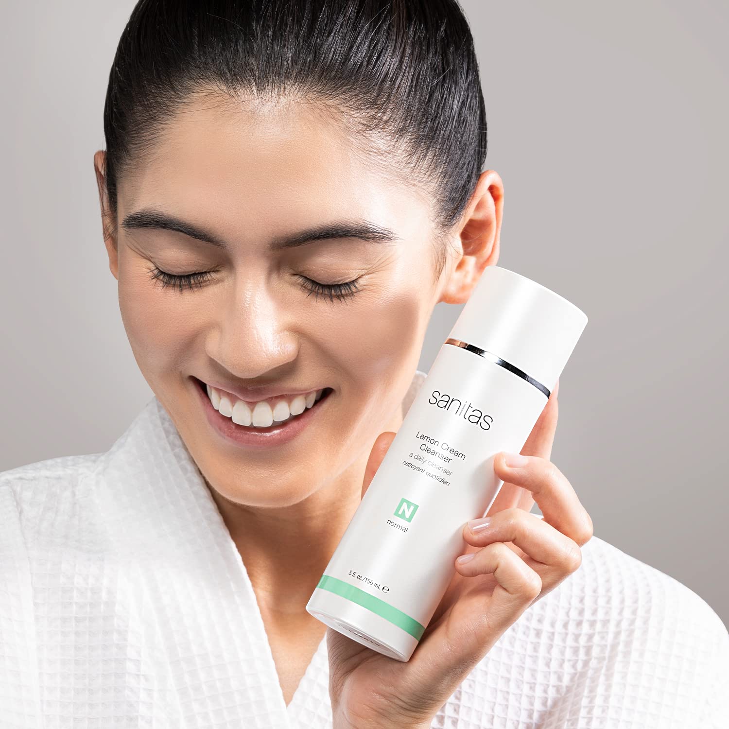 Sanitas Lemon Cream Cleanser on bathroom counter with lemon imagery for refreshed skin