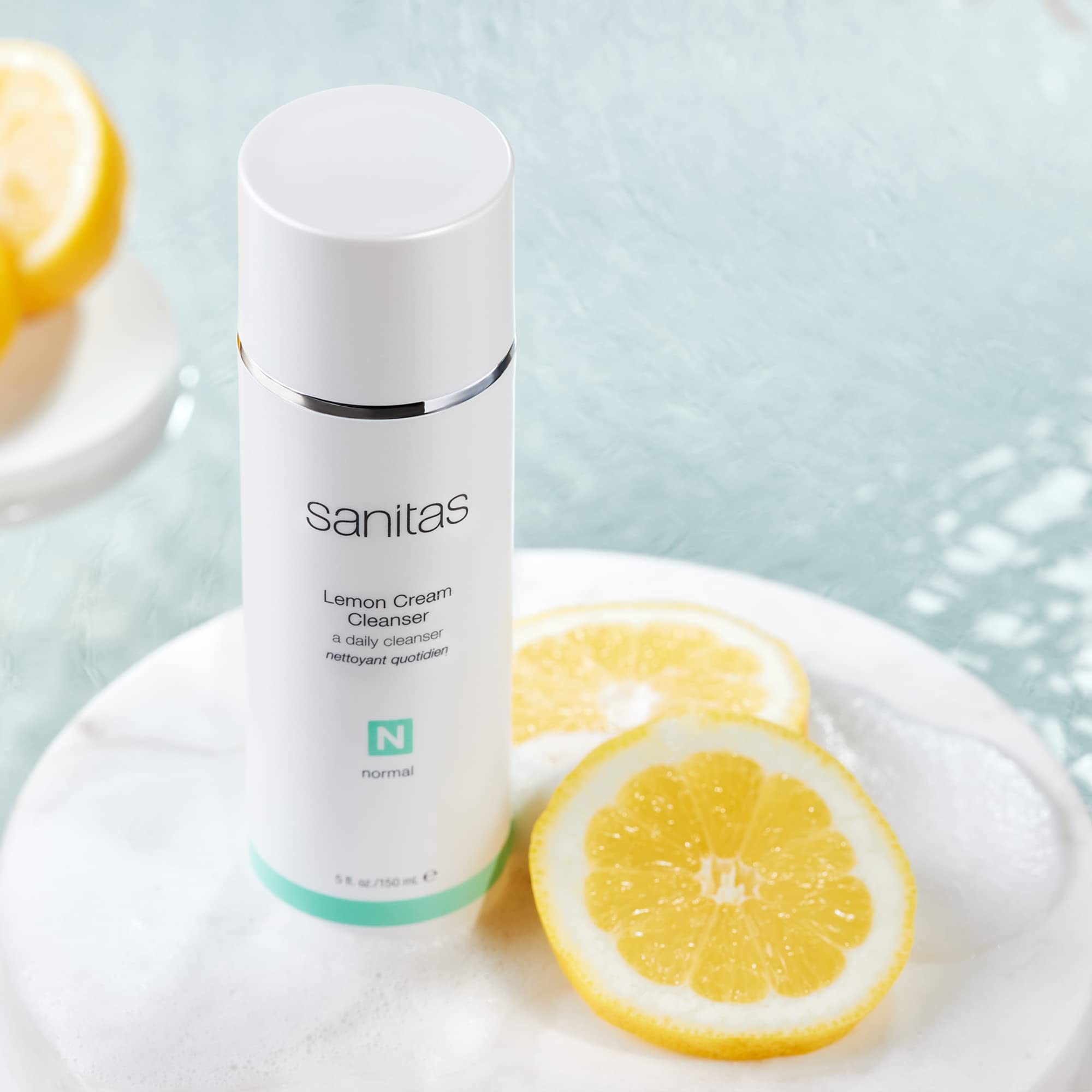 Sanitas Lemon Cream Cleanser pump bottle showing creamy texture for brightening cleanse