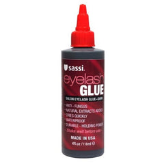 Sassi Eyelash Glue Dark 4oz bottle pour for quick-drying, waterproof hold.