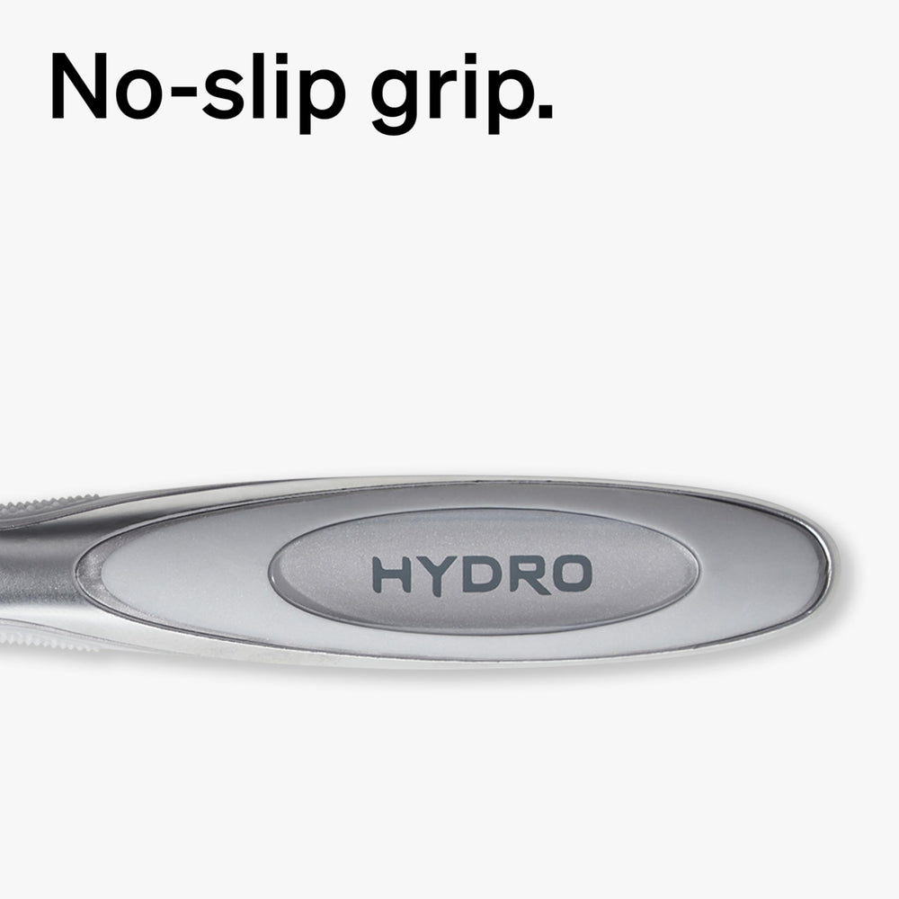 Schick Hydro Dry Skin Shock Absorb handle closeup conveys adaptive pressure during shaving.