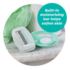 Schick Intuition Go four-blade design gliding over curves.